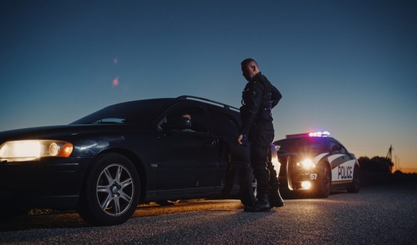 Portrait,Of,Middle,Aged,Caucasian,Cop,Approaching,A,Pulled,Over
